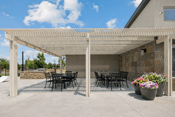 Outdoor pergola with dining area and seating
